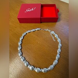 Lisa says Gah fish necklace